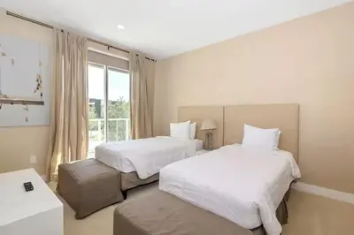 a hotel room with two beds and a window at Magical & Spacious Home Minutes from Disney Parks in Orlando
