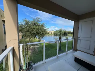 a balcony with a view of a body of water at Magical & Spacious Home Minutes from Disney Parks in Orlando