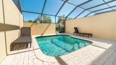 a swimming pool in a building with a glass roof at Windsor Hills 3 Bedroom Private Pool Townhome 0857 in Orlando