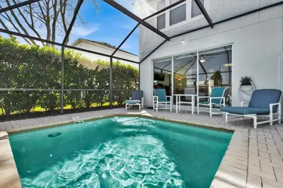 a swimming pool in the backyard of a house at Windsor Hills 3 Bedroom Private Pool Townhome 0858 in Orlando