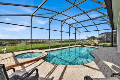 a swimming pool with a glass canopy over it at Windsor Hills Resort 6 Bedroom Private Pool Spa Home 0743 in Orlando