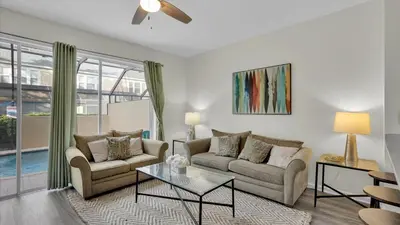 a living room with two couches and a table at Windsor Hills Resort 3 Bedroom Private Pool Townhome 0876 in Orlando