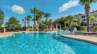 a pool at a resort with palm trees and a gazebo at Windsor Hills Resort 3 Bedroom Private Pool Townhome 0876 in Orlando