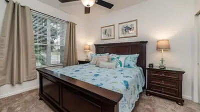 a bedroom with a bed with a dresser and a window at Windsor Hills Resort 5 Bedroom Home with Game Room 0851 in Orlando