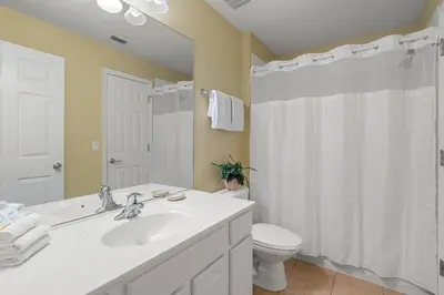 a bathroom with a white sink and a toilet at Windsor Hills Resort 5 Bedroom Private Pool Home 0869 in Orlando