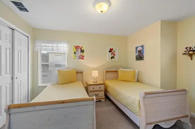 a bedroom with two beds and a window at Windsor Hills Resort 5 Bedroom Private Pool Home 0869 in Orlando