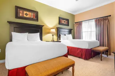 a hotel room with two beds and a window at AQ0401 Villas North Charm in Orlando