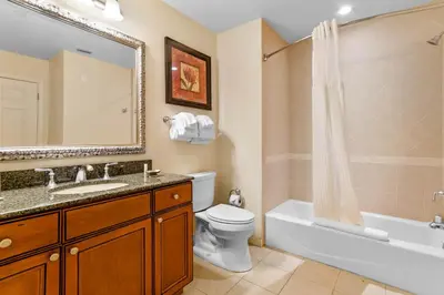 a bathroom with a sink and a toilet and a bath tub at AQ0401 Villas North Charm in Orlando