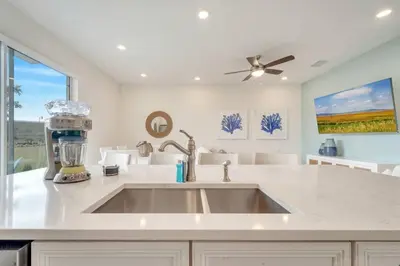 a kitchen with a mixer on top of a sink at Just Lauched - Luxury & Cozy 3BR near Disney-Margaritaville in Orlando