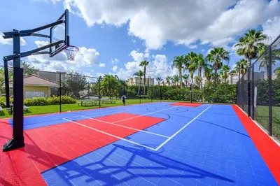 a basketball court with a basketball hoop at Epic Universe Deluxe Condo, Vista Cay - 3002 in Orlando