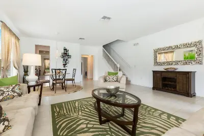 a living room with a couch and a table at Villa Martins, Bella Vida in Kissimmee