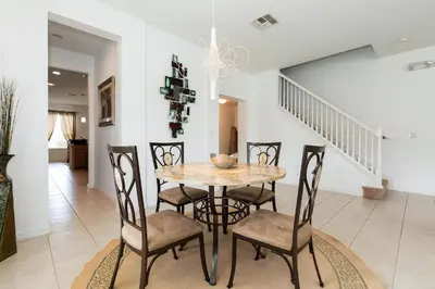 a dining room with a table and chairs at Villa Martins, Bella Vida in Kissimmee