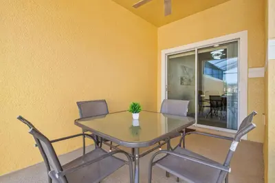 a dining room with a table and chairs at Lakefront 4 Bed private Oasis Location in Kissimmee