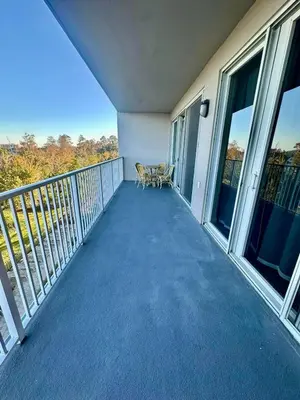 a balcony with a table and chairs on it at Heron Lake in Orlando