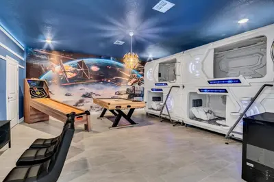 a recreational room with a ping pong table and an rv at Brand New Storey Lake 10 Bedroom Villa with Pool in Kissimmee