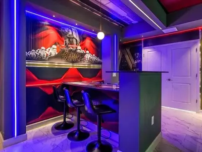 a bar with blue lights in a room at Brand New Storey Lake 9BR Villa Summer Kitchen in Kissimmee