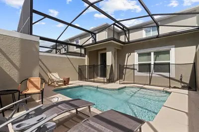 an indoor swimming pool with a glass roof at 4184PD Weekly Stay 5BR Free Water Park in Kissimmee