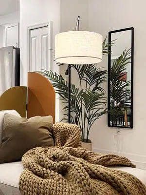 a bedroom with a bed with a blanket and a lamp at 4184PD Weekly Stay 5BR Free Water Park in Kissimmee