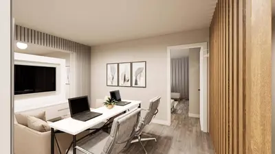 a living room with a desk with a laptop on it at 3251 The Hub escape with flex space in Kissimmee