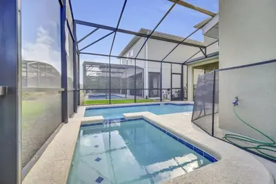 a swimming pool in a house with a glass ceiling at Dazzling 5BR Villa in Storey Lake with Pool & Spa 1528 in Kissimmee