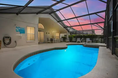 a large swimming pool with a glass ceiling at CLD4676 in Kissimmee