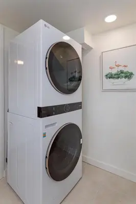 a washer and dryer in a white wall at Hope House- Vacation Village 1 Bedroom with Loft in Clermont