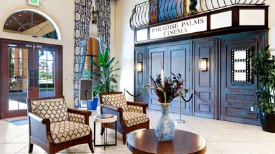 a lobby with chairs and a vase on a table at CUP8931 in Kissimmee