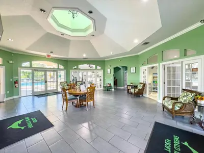 a living room with a table and chairs at SKP2764 in Kissimmee