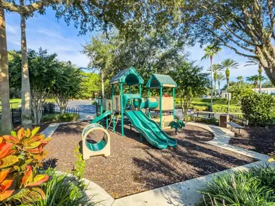 a playground with a slide in a park at SKP2764 in Kissimmee