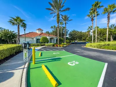 a street with a bike parking lot with palm trees at SKP2764 in Kissimmee