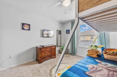 a bedroom with a bed with a star wars toy on it at Wonderful 4 bed Family Home with Private Pool in Kissimmee