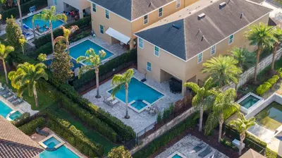 an aerial view of a house with two swimming pools at Classic 8bd house - Encore Reunion Close to Disney in Orlando