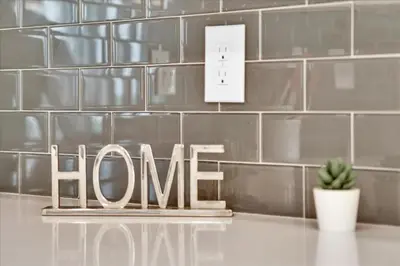 a sign that says home in front of a tiled wall at PXC3151-306 in Kissimmee