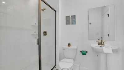 a bathroom with a shower and a toilet and a sink at OMW2718 in Kissimmee