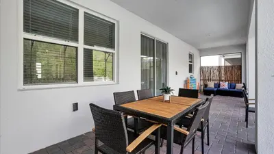 a dining room with a table and chairs at OMW2718 in Kissimmee