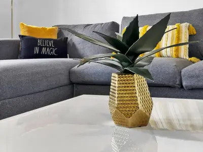 a vase on a coffee table in front of a couch at GDL3206 in Kissimmee