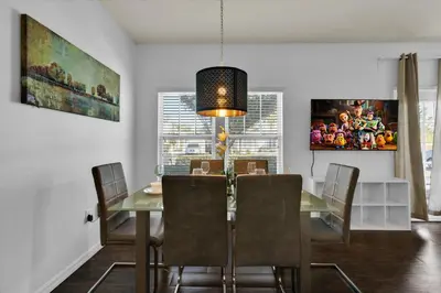 a dining room with a table and chairs at GDL3206 in Kissimmee