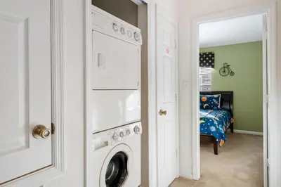 a laundry room with a washer and dryer at MSW2563 in Orlando