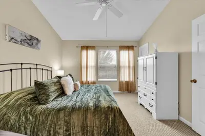 a bedroom with a bed and a ceiling fan at SKC7644 in Orlando