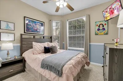 a bedroom with a bed and a ceiling fan at SPD2302-103 in Kissimmee