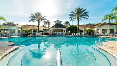 a swimming pool at a resort with palm trees at SPD2304-205 in Kissimmee