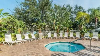 a group of chairs and a swimming pool at BF2302-203 Windsor Palms Resort 3 Bedroom in Kissimmee