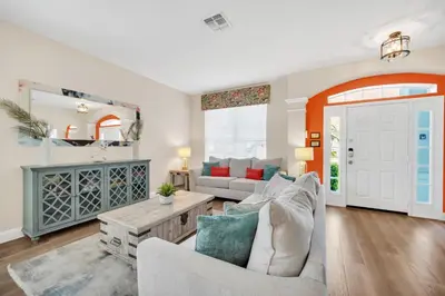 a living room with a couch and a table at Getaway Cove Villa in Orlando