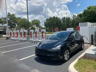a black car is parked in a parking lot at Carri-Vision Suite in Kissimmee