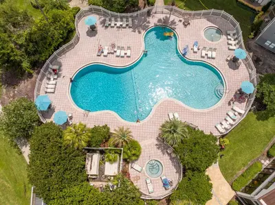 an overhead view of a swimming pool with chairs and a pool at Luxury Lakeview Getaway 1 mile Universal Studios in Orlando