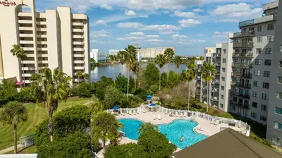 an aerial view of a pool in a resort with buildings at Luxury Lakeview Getaway 1 mile Universal Studios in Orlando