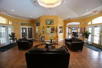 a large living room with couches and a table at Vacation Villa Near Disney With Private Pool Spa in Kissimmee