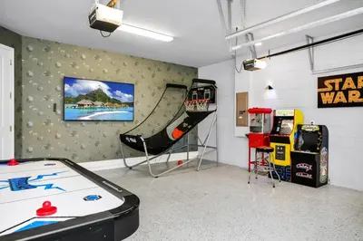 a room with a pool table and a slide at Magnificent Home With Private Pool, Theater & Game Room Near Disney With Waterpark & Resort Access At Encore Resort - 230Bu in Kissimmee