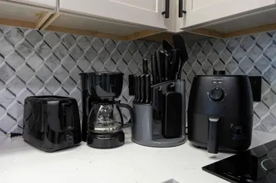 a kitchen counter with various appliances on a counter top at Spacious 1BR near Universal I-Drive in Orlando
