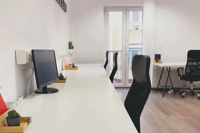 an office with a long table with chairs and a computer at NEW King Bed Disney Contemporary Townhouse in Kissimmee